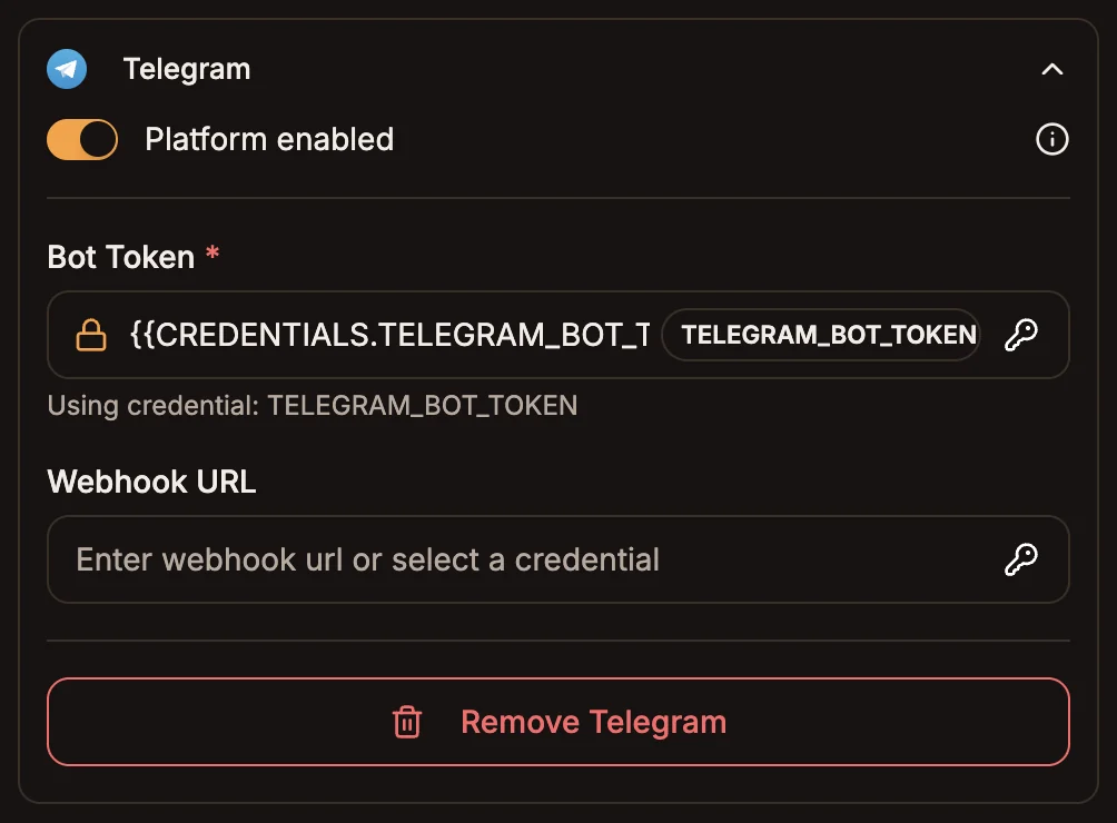The Telegram section of the trigger node's Platforms tab with the Bot Token field set to a placeholder credential